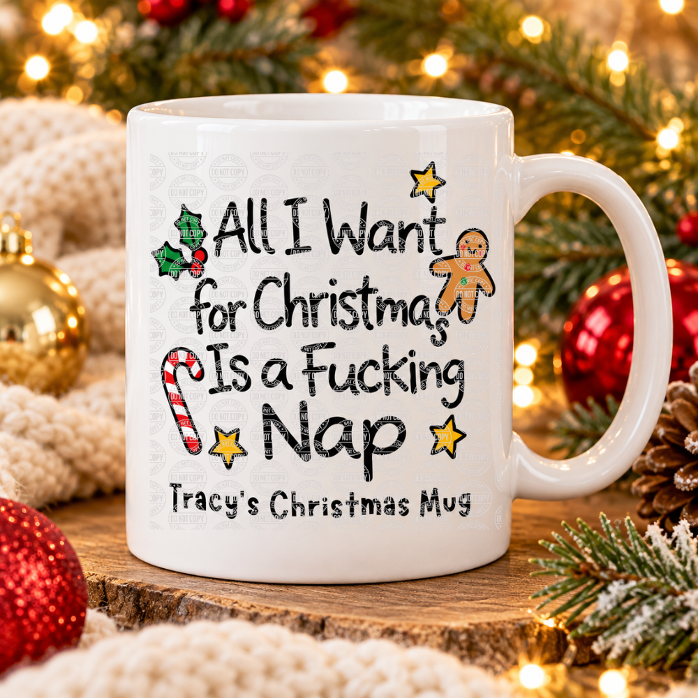 A white ceramic mug with a humorous Christmas message, displayed on a rustic wood slice surrounded by festive holiday decorations including red ornaments, pine branches, and warm string lights.