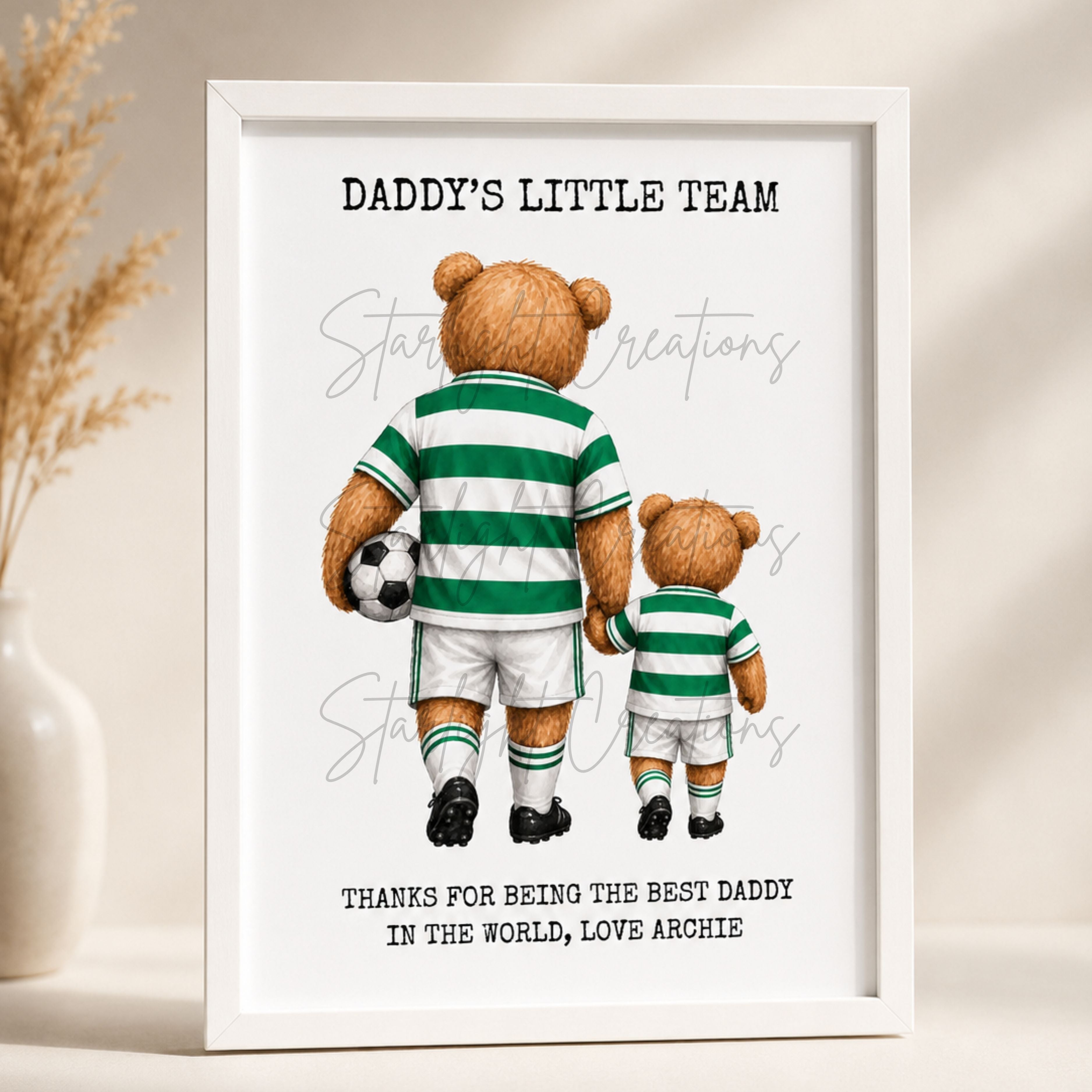 Framed artwork with two teddy bears in green and white striped soccer uniforms, holding a soccer ball, on a beige background.