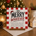 Merry Whatever funny cheeky Christmas card with red gingham border, Santa hat and holly illustration, standing on a wooden card holder next to a white envelope