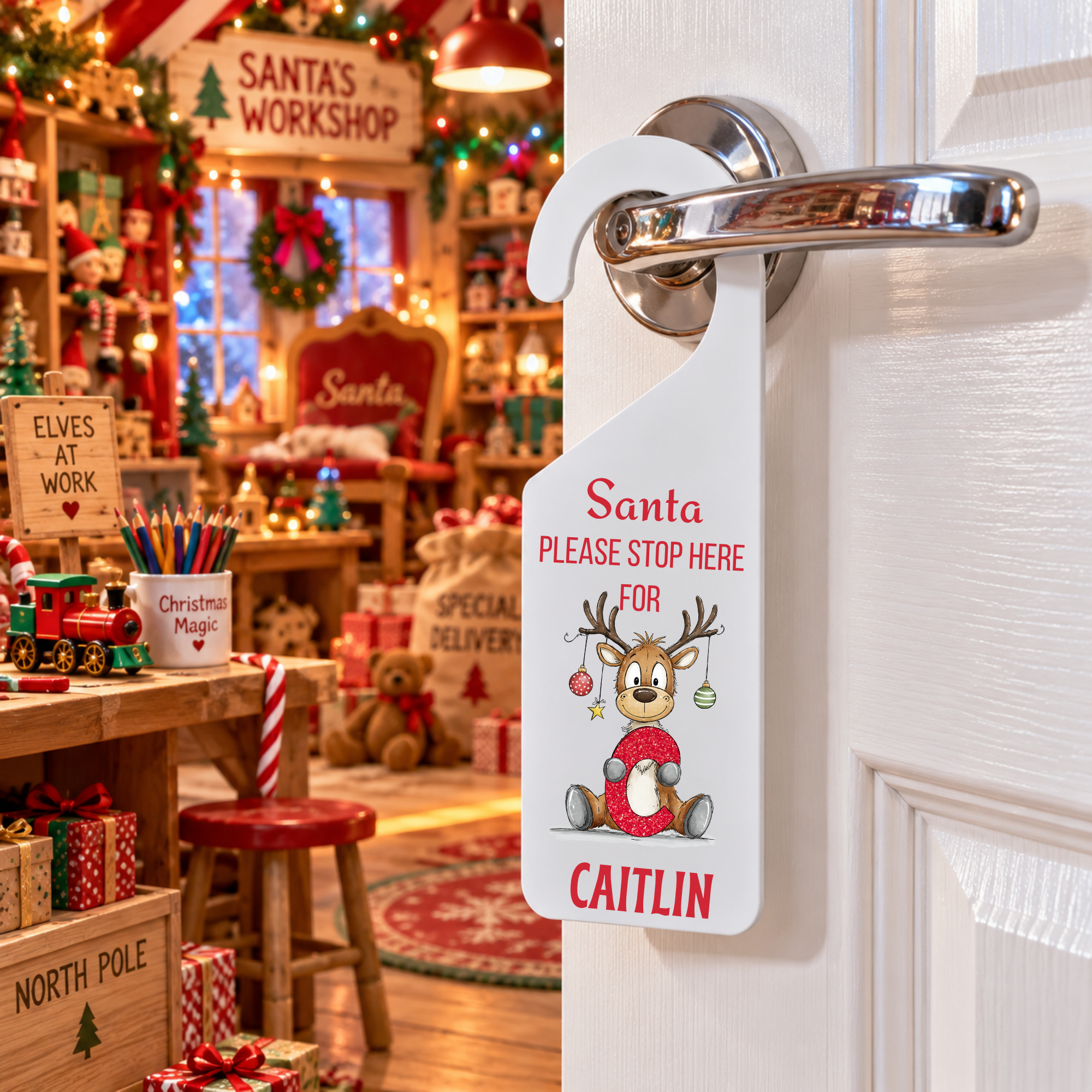 Personalised reindeer alphabet Christmas door hanger with the name caitlin, hooks over door handle, matte white frost acrylic