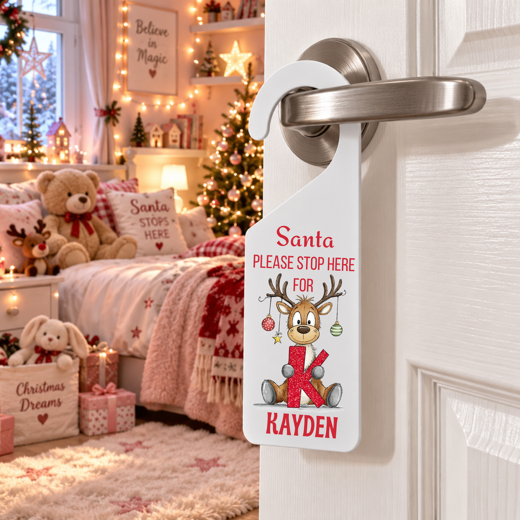 Personalised reindeer alphabet Christmas door hanger with the name Kayden, hooks over door handle, matte white frost acrylic