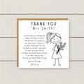 Thank you card for a teacher with a stick figure holding flowers on a wooden background
