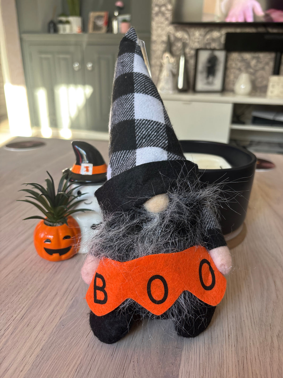Halloween gonk with black-and-white check hat, fluffy grey beard and orange BOO banner