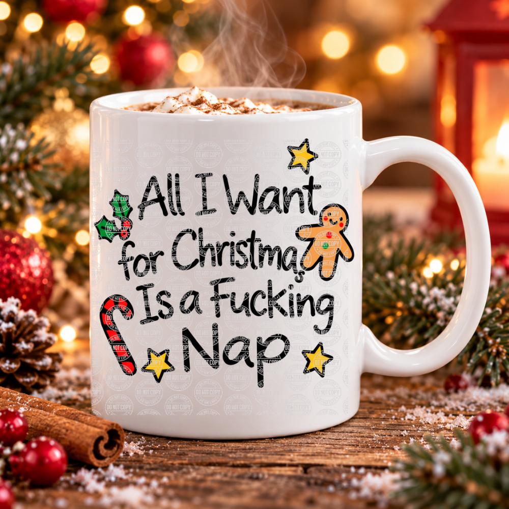 White ceramic funny Christmas mug with a cheeky nap slogan, gingerbread man, candy cane and holly, filled with hot chocolate