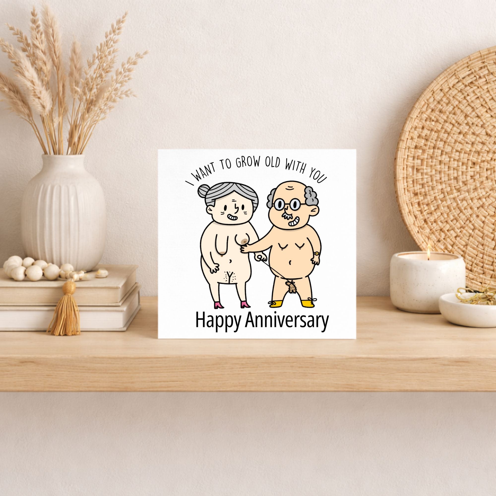 Card with cartoon illustration of elderly couple on a shelf with decorative items.