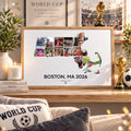 A framed custom sports wall art print featuring a Boston, MA 2026 World Cup collage, styled on a wooden shelf in a cozy room setting with a World Cup pillow, candle, and trophy props.