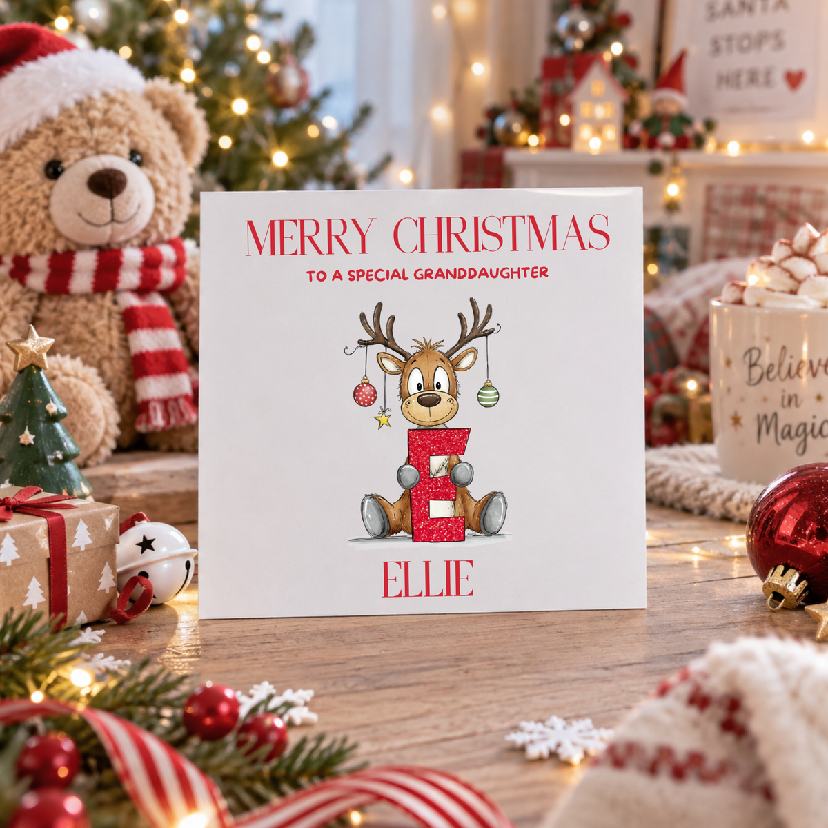 Personalised reindeer alphabet Christmas card for a grandson named Ellie, blank inside, 6x6 inch card with white envelope