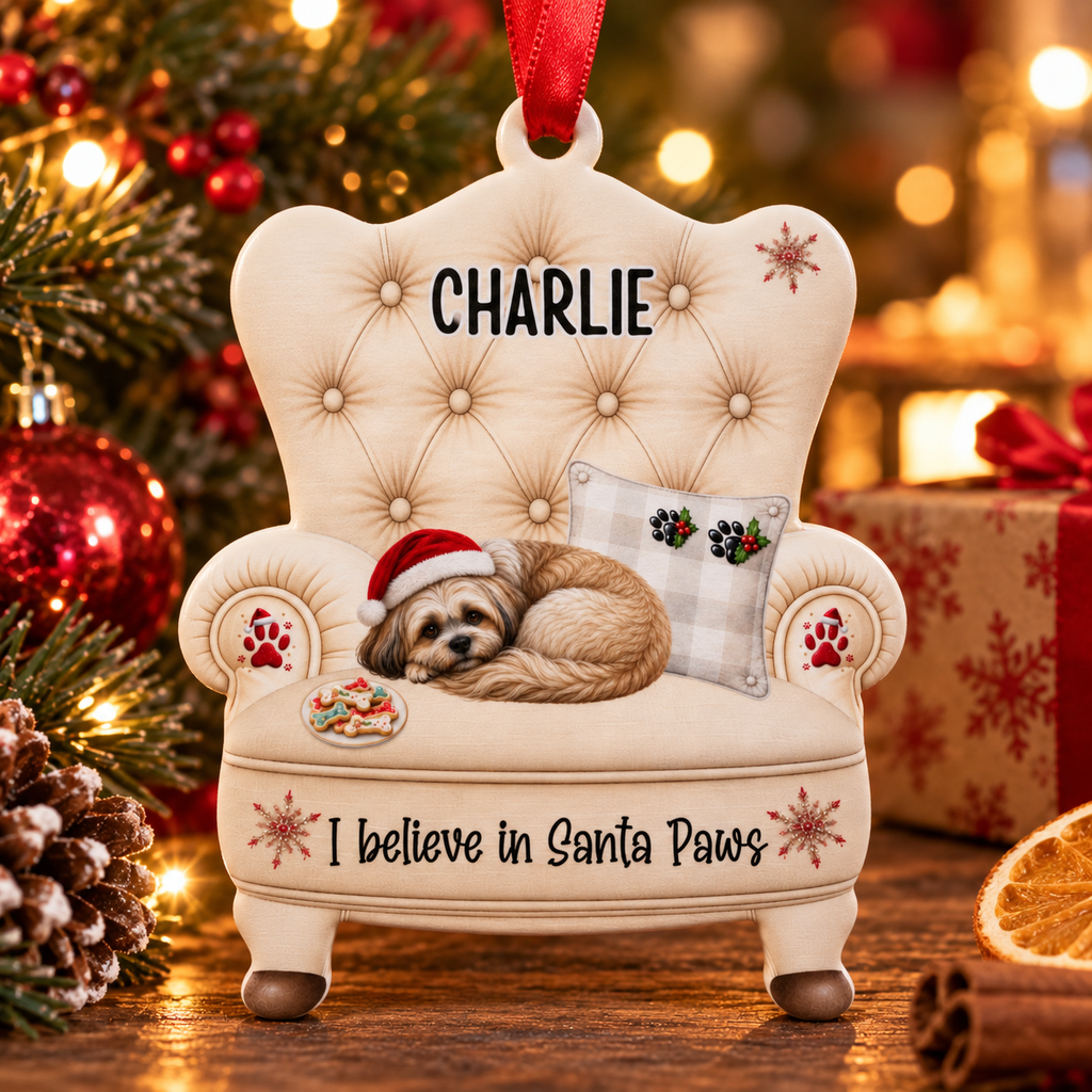 Personalised Christmas dog bauble shaped like an armchair, with a Lhasa Apso asleep in a Santa hat and a custom name