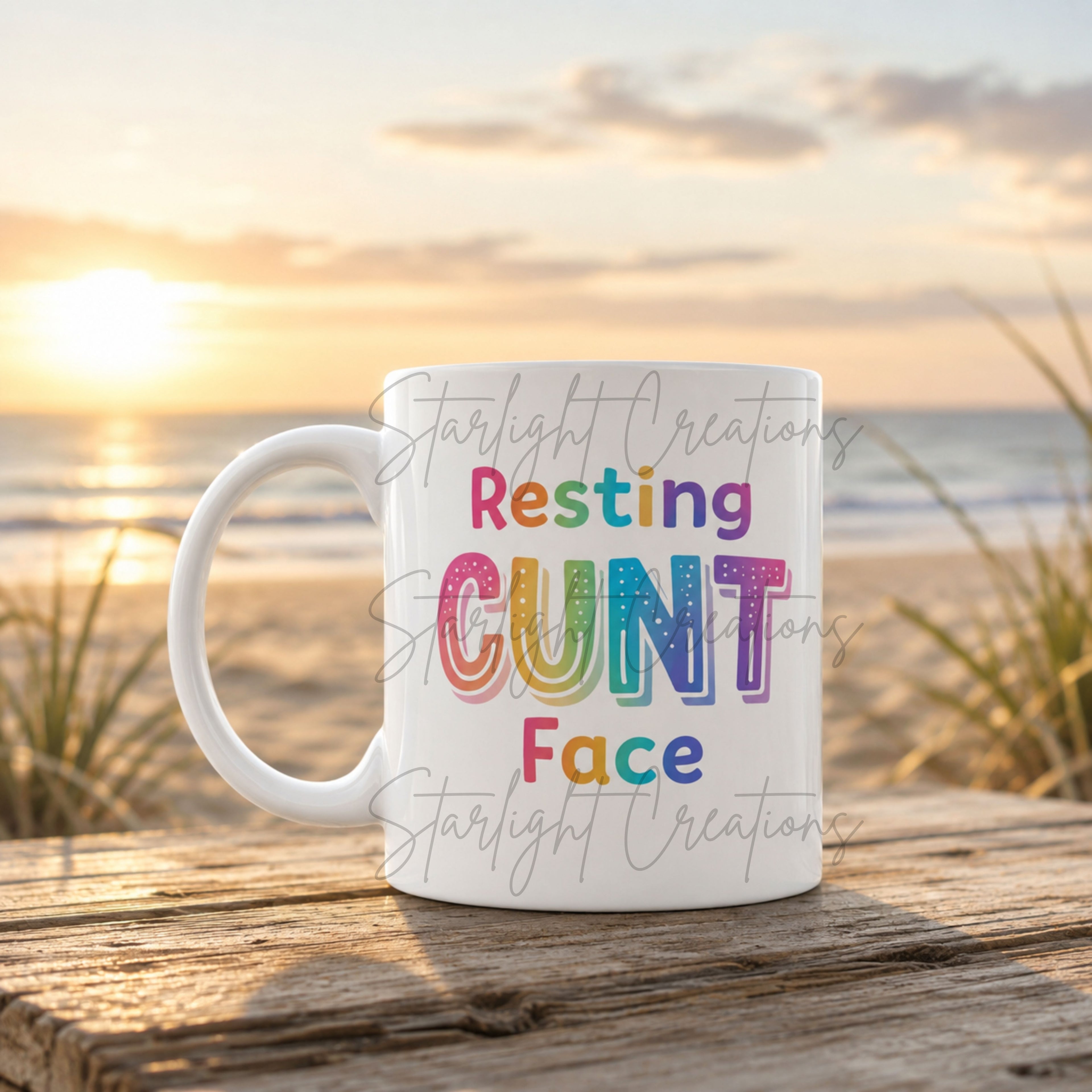 Mug with colorful text on a beach at sunset