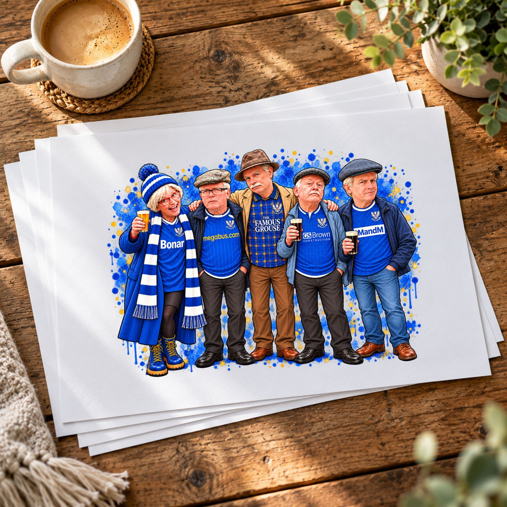 A stack of custom watercolor art prints featuring five men in blue football jerseys, displayed on a rustic wooden table next to a coffee cup.
