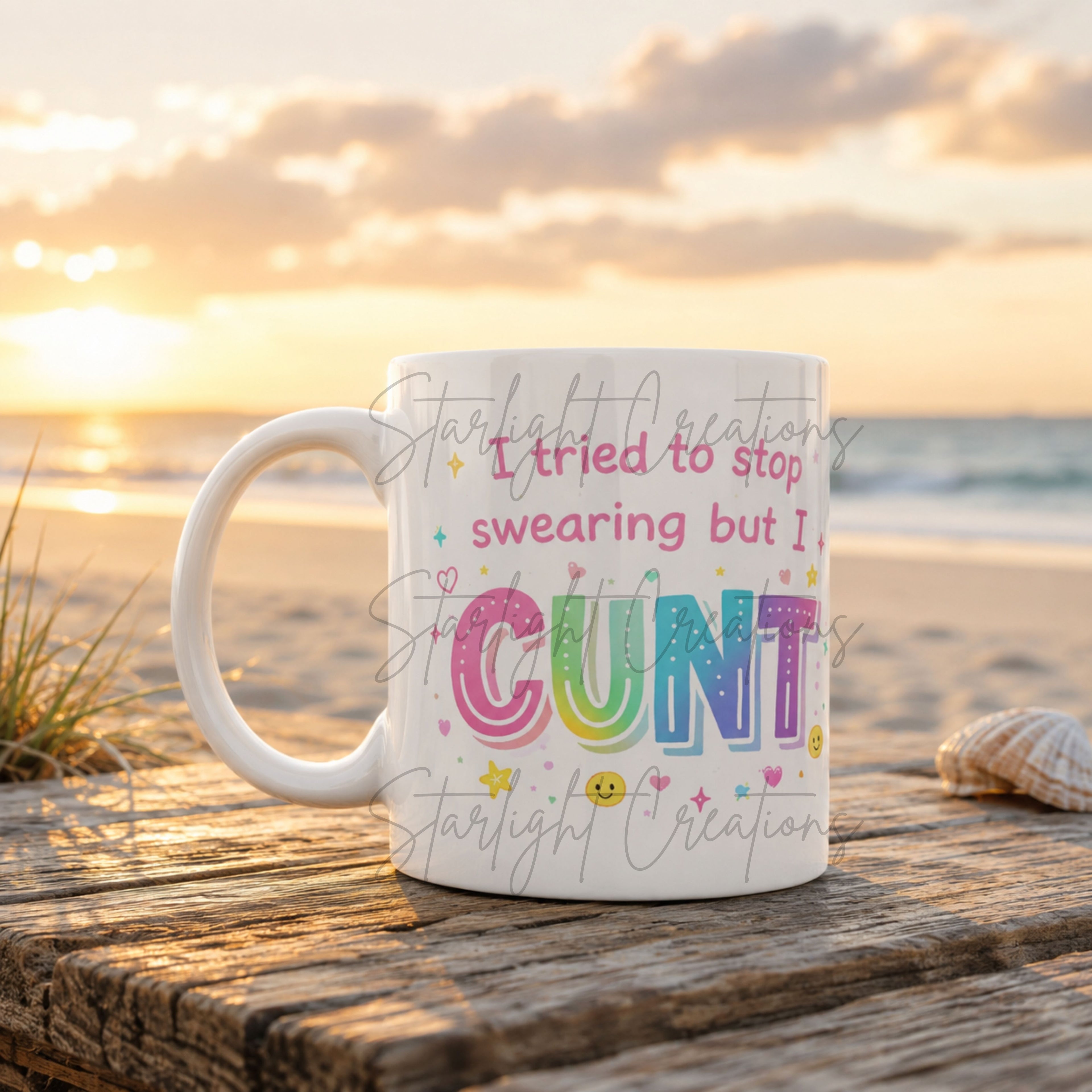 Mug with colorful text on a beach at sunset