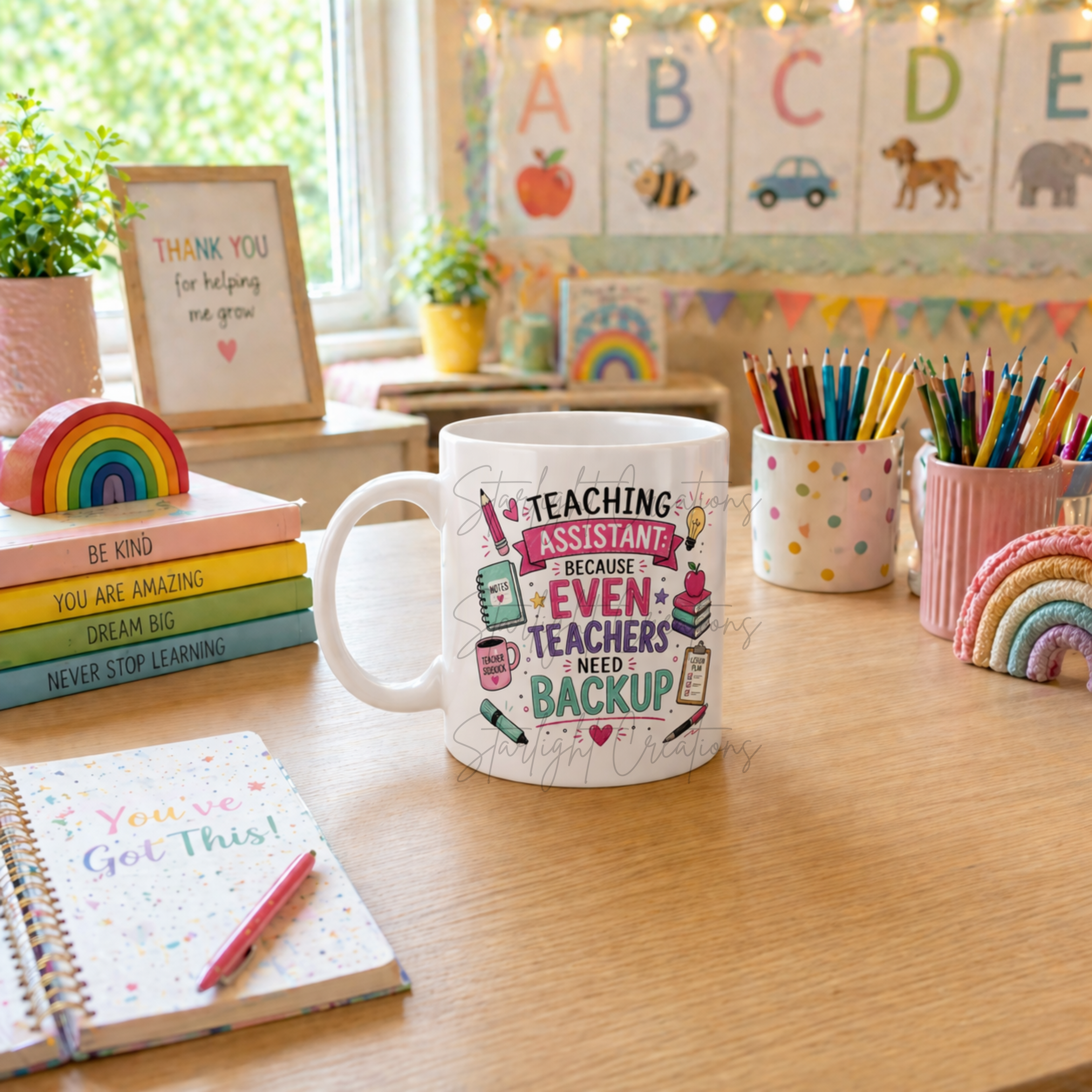 Mug with 'Teaching Assistant' design on a desk with educational decor