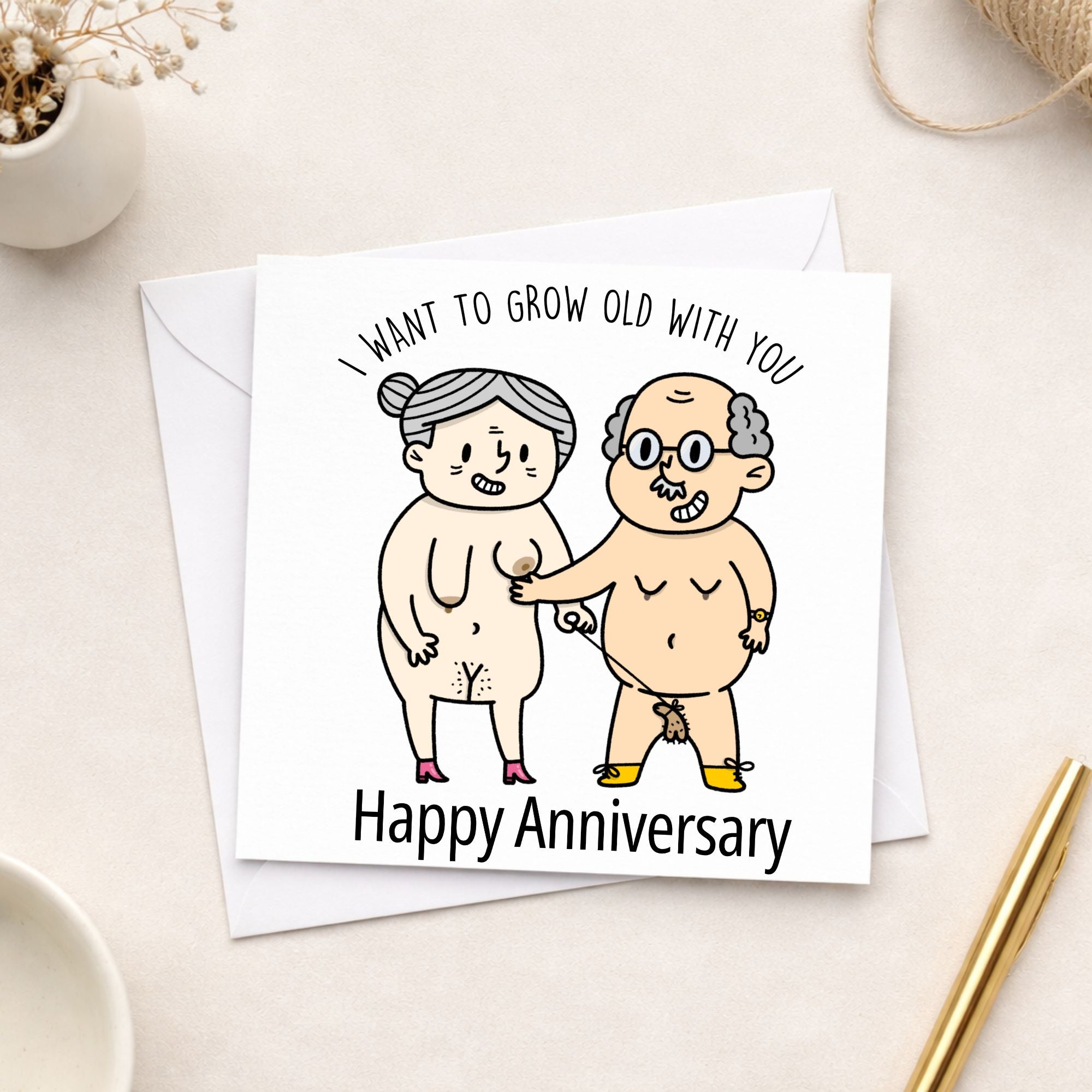 Card with cartoon illustration of an elderly couple and text 'I want to grow old with you. Happy Anniversary.